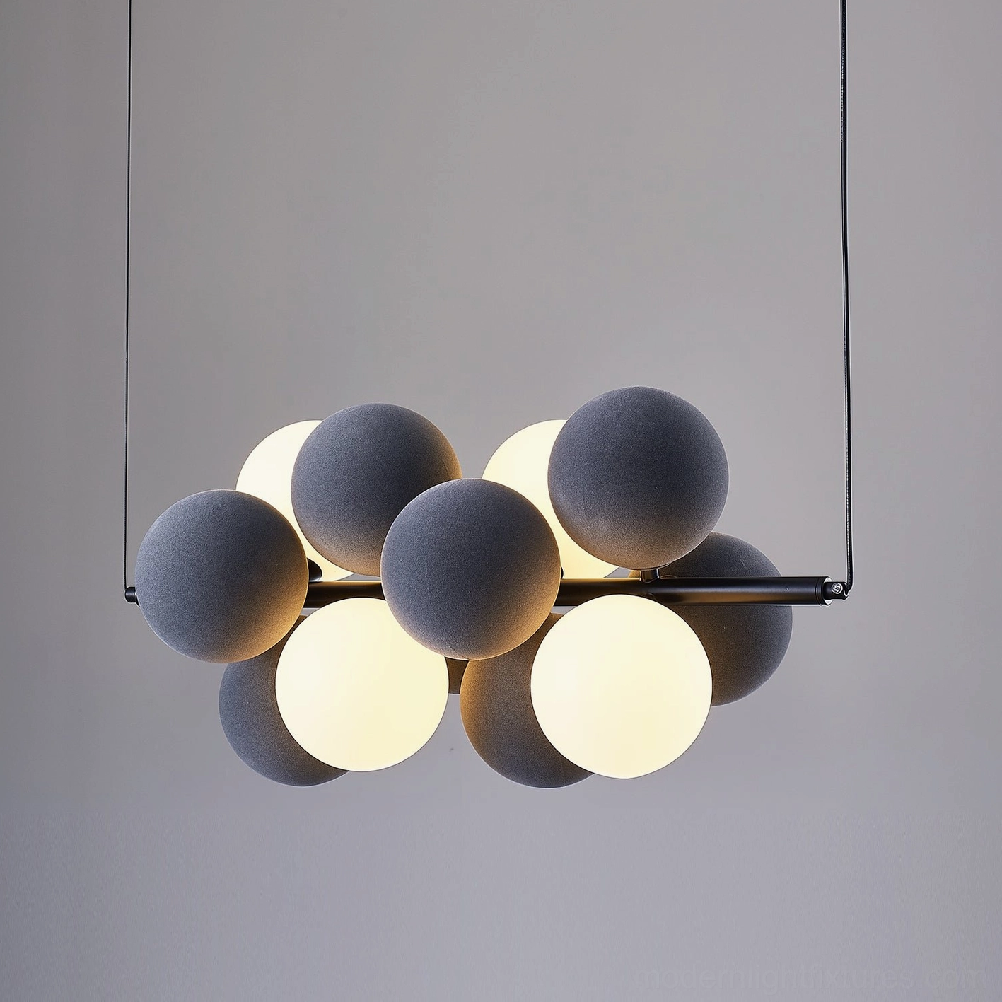 Bubble pendant light white finish creating visual lightness expanding spatial perception