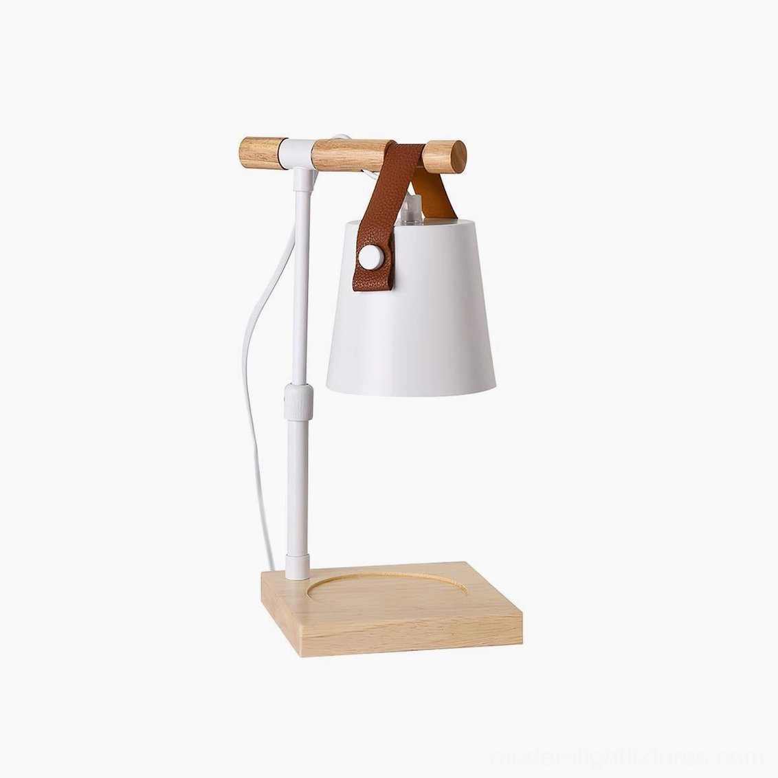 White metal candle warmer lamp with natural wood base and leather strap on white background, minimalist design