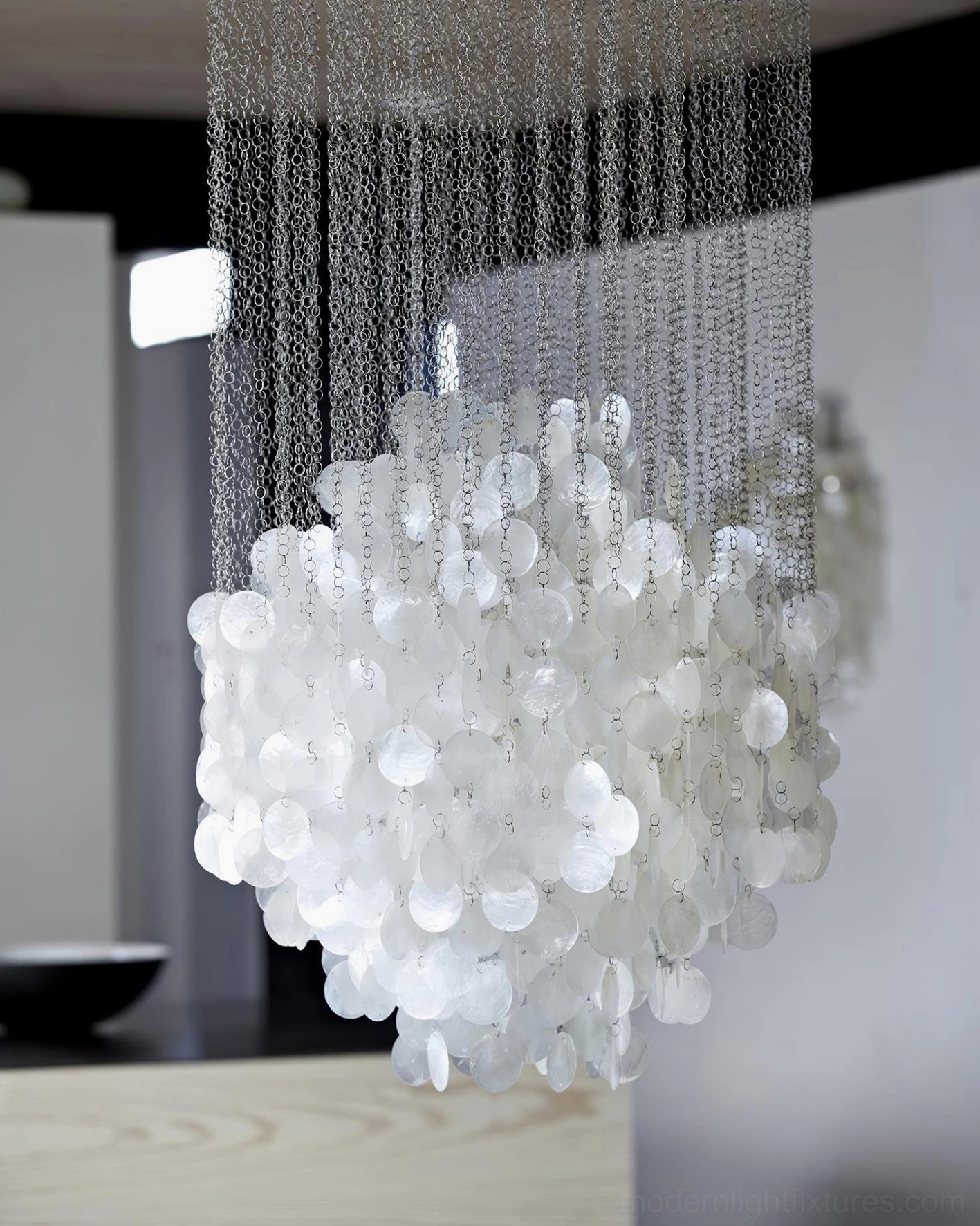 White capiz shell pendant chandelier with adjustable hanging chain in luxury residential interior design