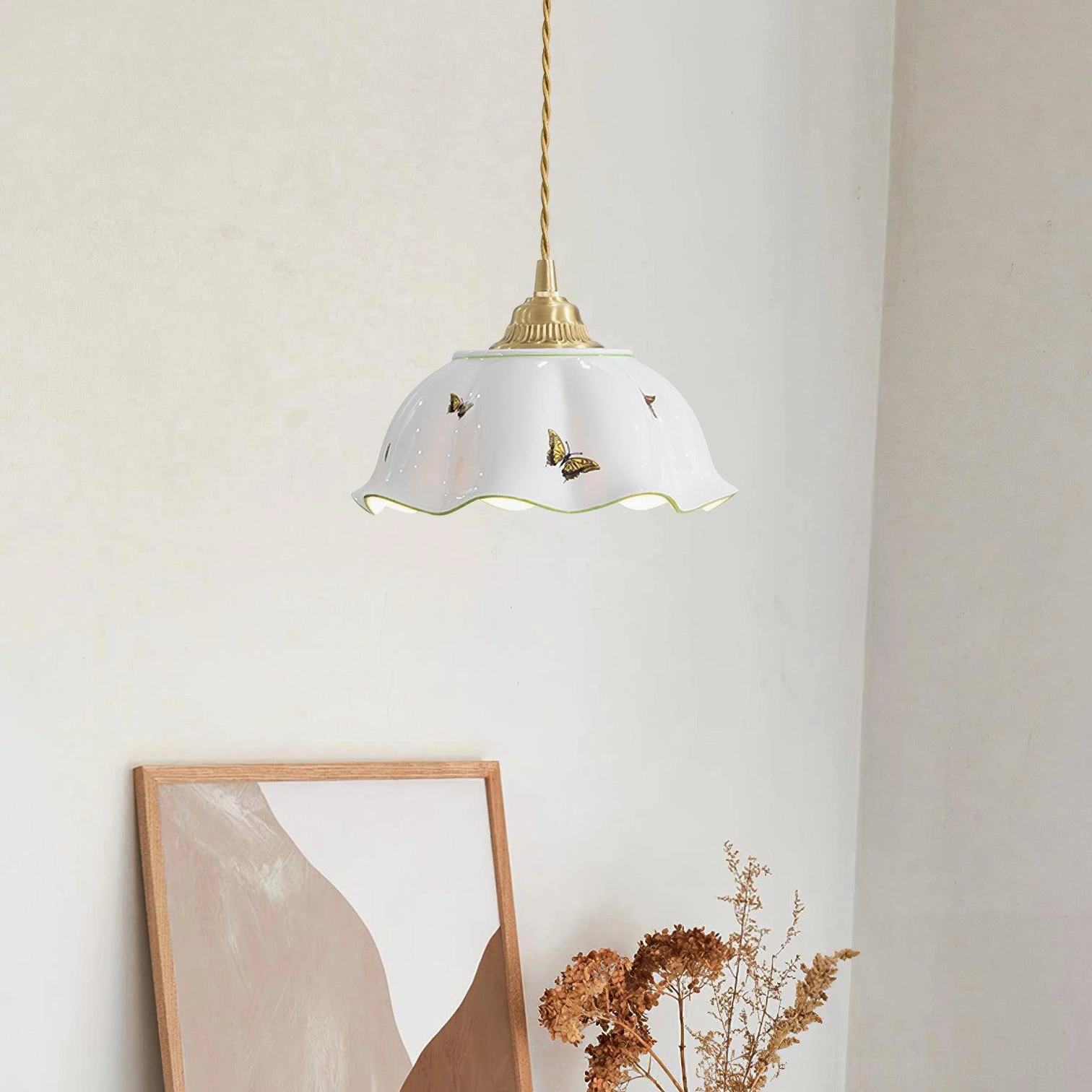 Handcrafted ceramic pendant lamp hanging in living room, French minimalist interior design