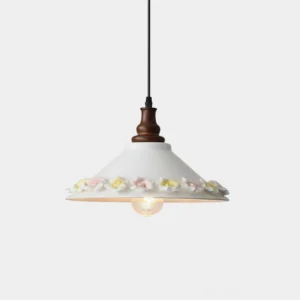 Ceramic floral pendant light with white conical shade and pastel bloom trim, front view with studio backdrop