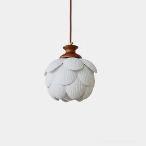 White ceramic lotus pendant light with hand-shaped porcelain petals and warm oak wood cap, front view on white background