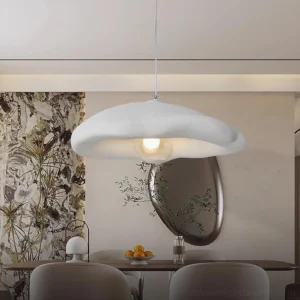 White cloud pendant light with exposed G9 bulb in modern formal dining room setting