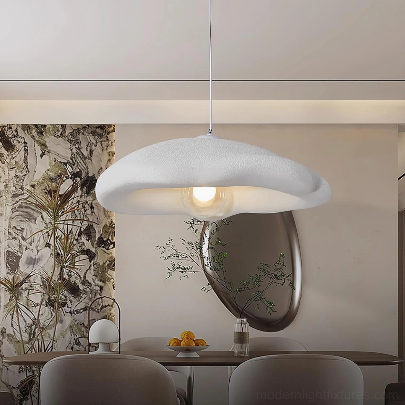 White cloud pendant light with exposed G9 bulb in modern formal dining room setting