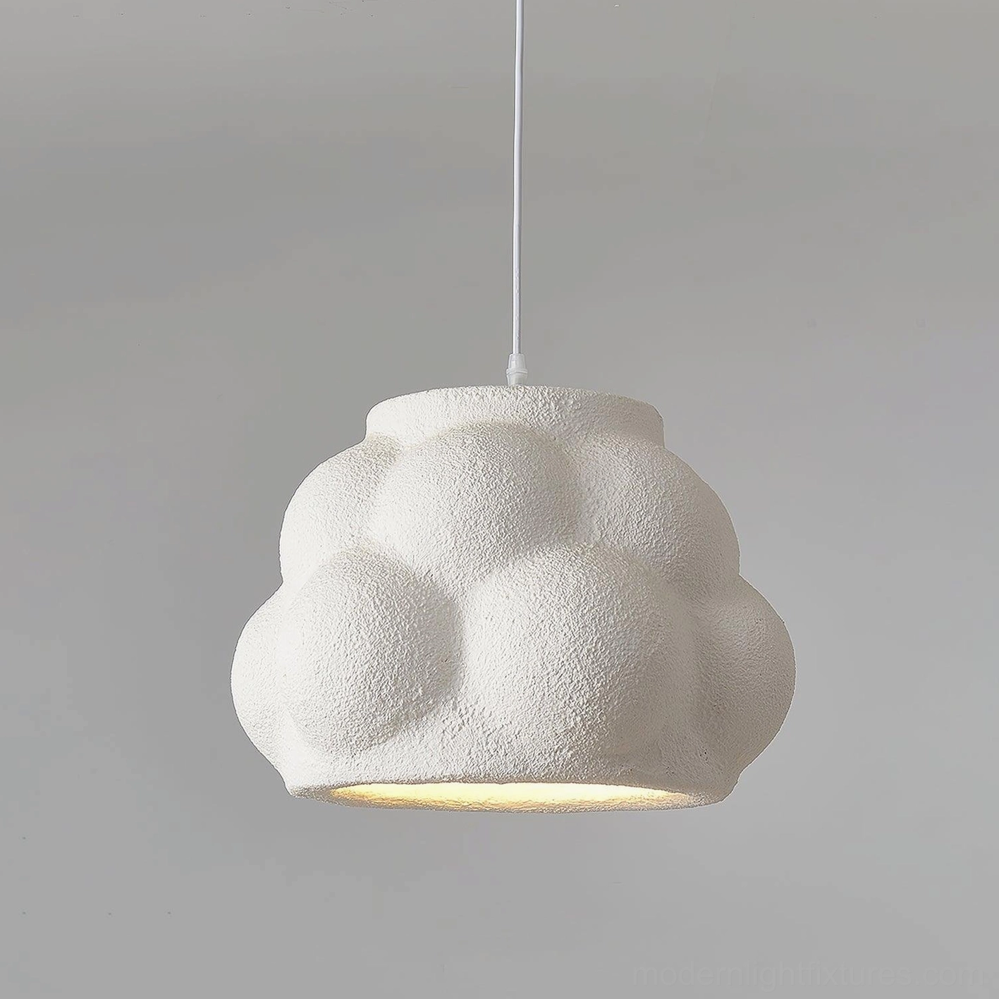 White cloud pendant light with warm LED bulb creating soft diffused ambient lighting