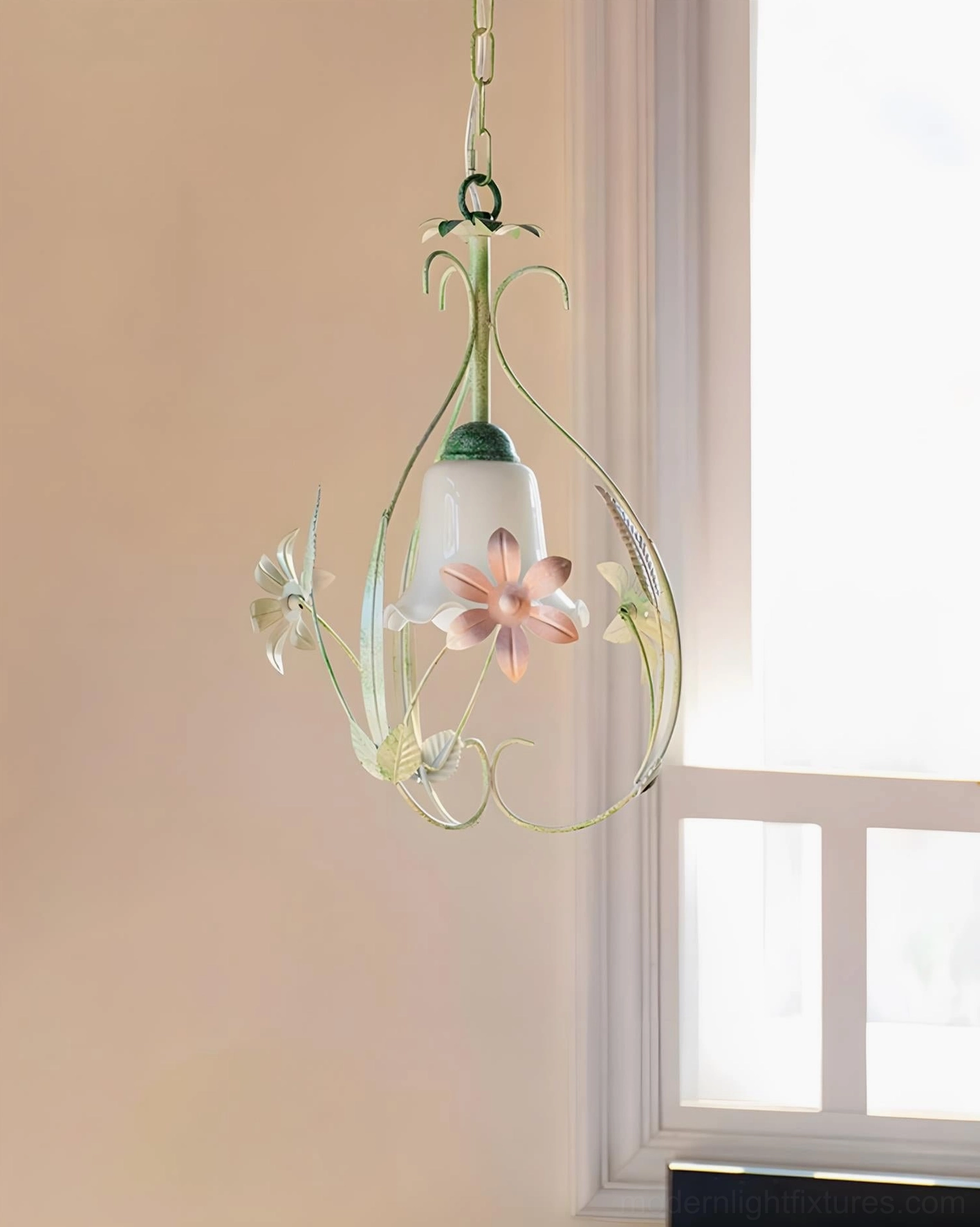 White cottage pendant light with sculptural wrought iron frame and painted flower details in minimalist setting