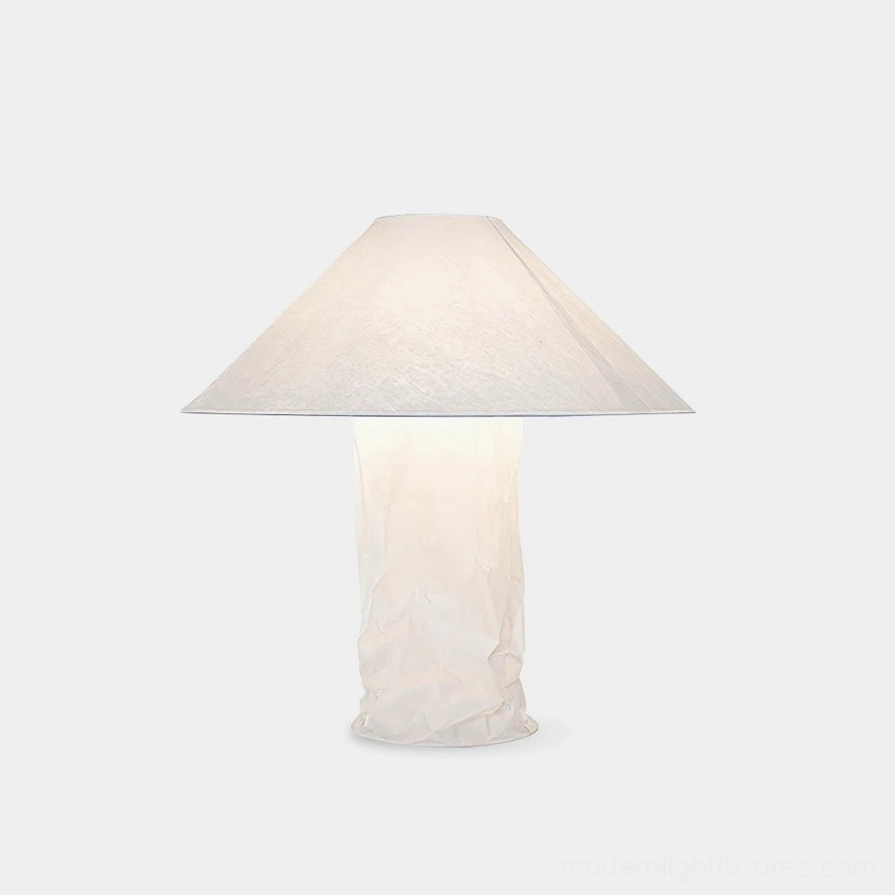 Artisan crinkled paper modern table lamp with white finish, front view on minimalist background