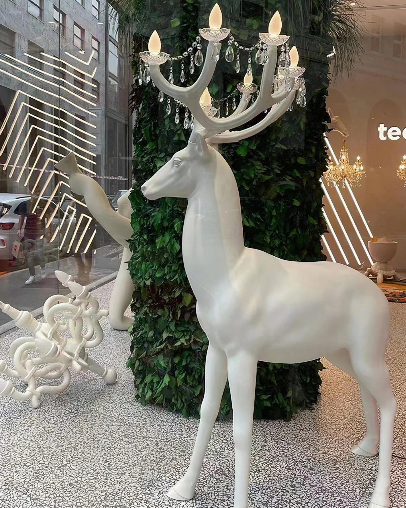 White matte finish deer lamp right side profile in commercial outdoor environment