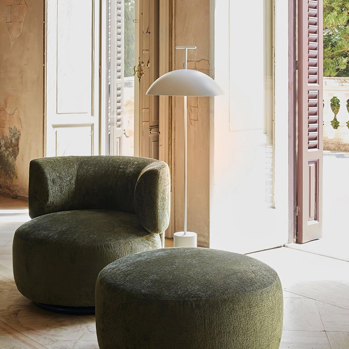 White dome floor lamp side profile view in minimalist sunlit entryway interior