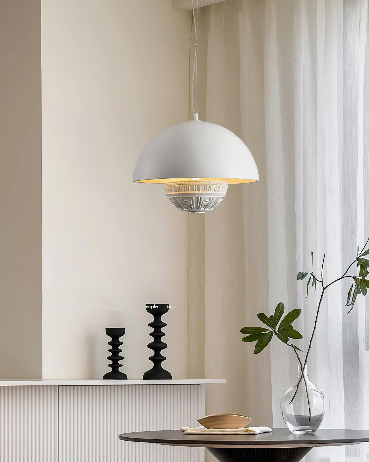 Single white dome pendant light by side table in minimalist interior design