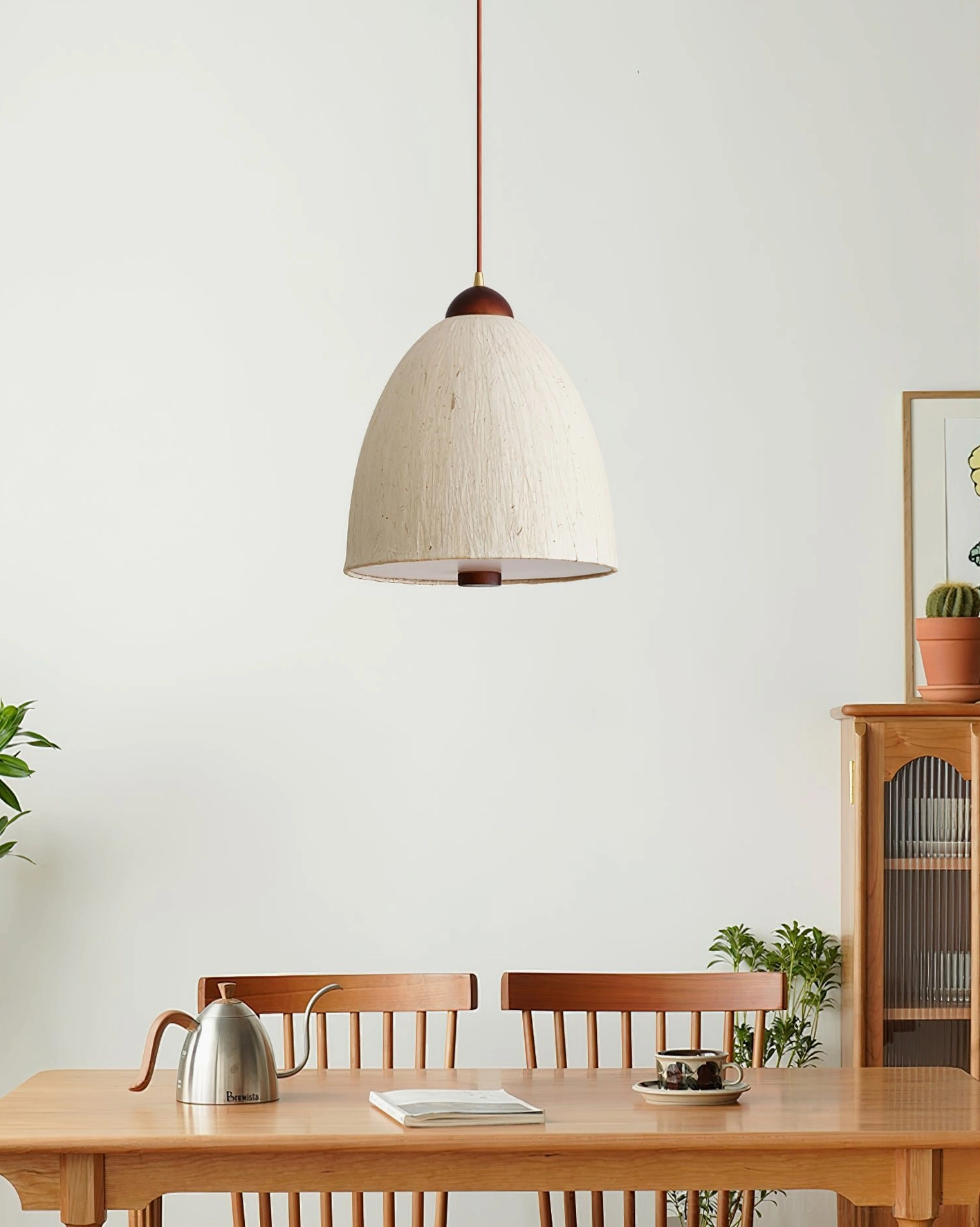 Off-white linen Doria pendant light in Japanese minimalist dining room with wooden table setting