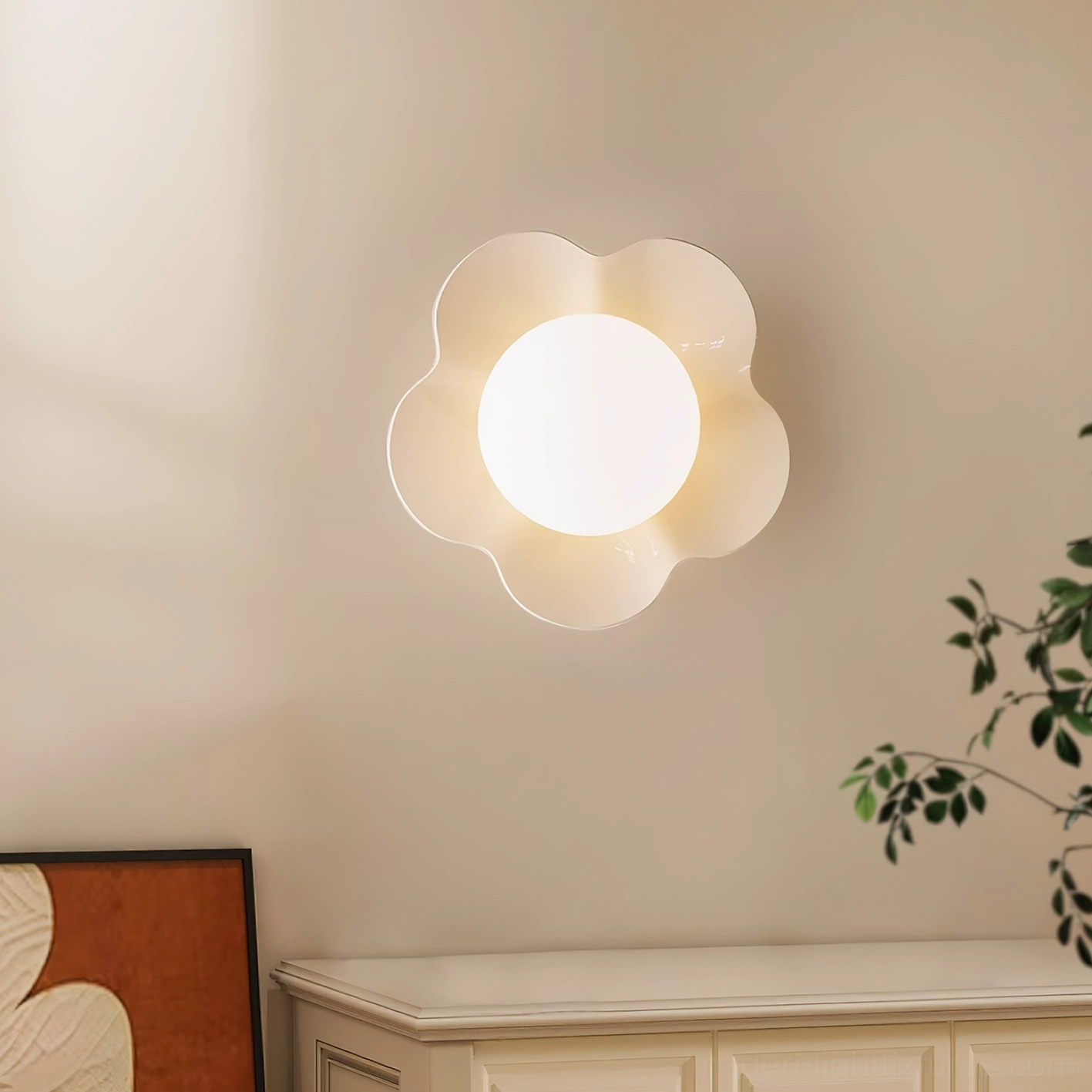 Off-white Fleur wall lamp on neutral interior wall with sideboard and artwork - contemporary sculptural wall sconce