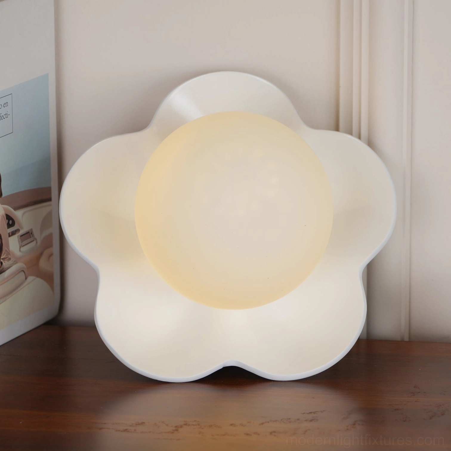 White Fleur wall sconce mounted on gallery wall - botanical art-forward wall lamp installation aesthetic
