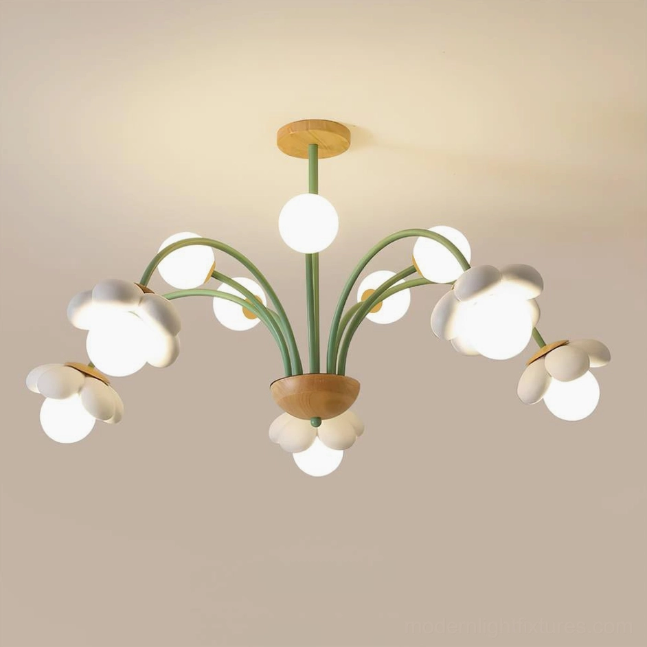White floral chandelier with cloud-shaped light covers and green metal framework, three-quarter overhead view