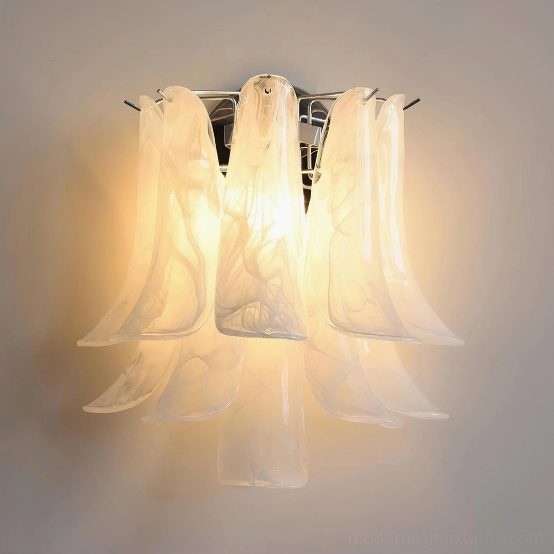 Frosted white flower petal wall sconce with semi-transparent glass petals creating ambient glow, modern lighting design