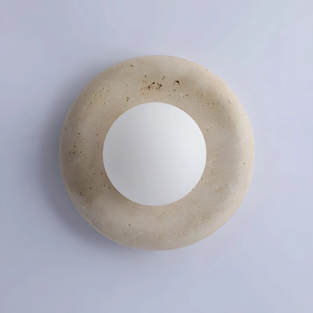 White frosted glass globe detail on orb wall sconce, showing diffused warm light quality