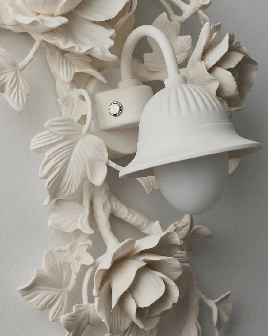 White ivory Elysia Bloom sculptural rose wall sconce in minimalist interior, understated plaster-like botanical relief