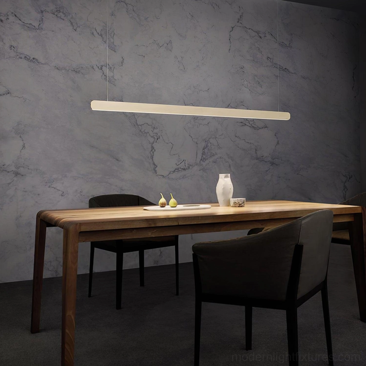 White linear pendant light fixture creating ambient illumination in open plan modern home