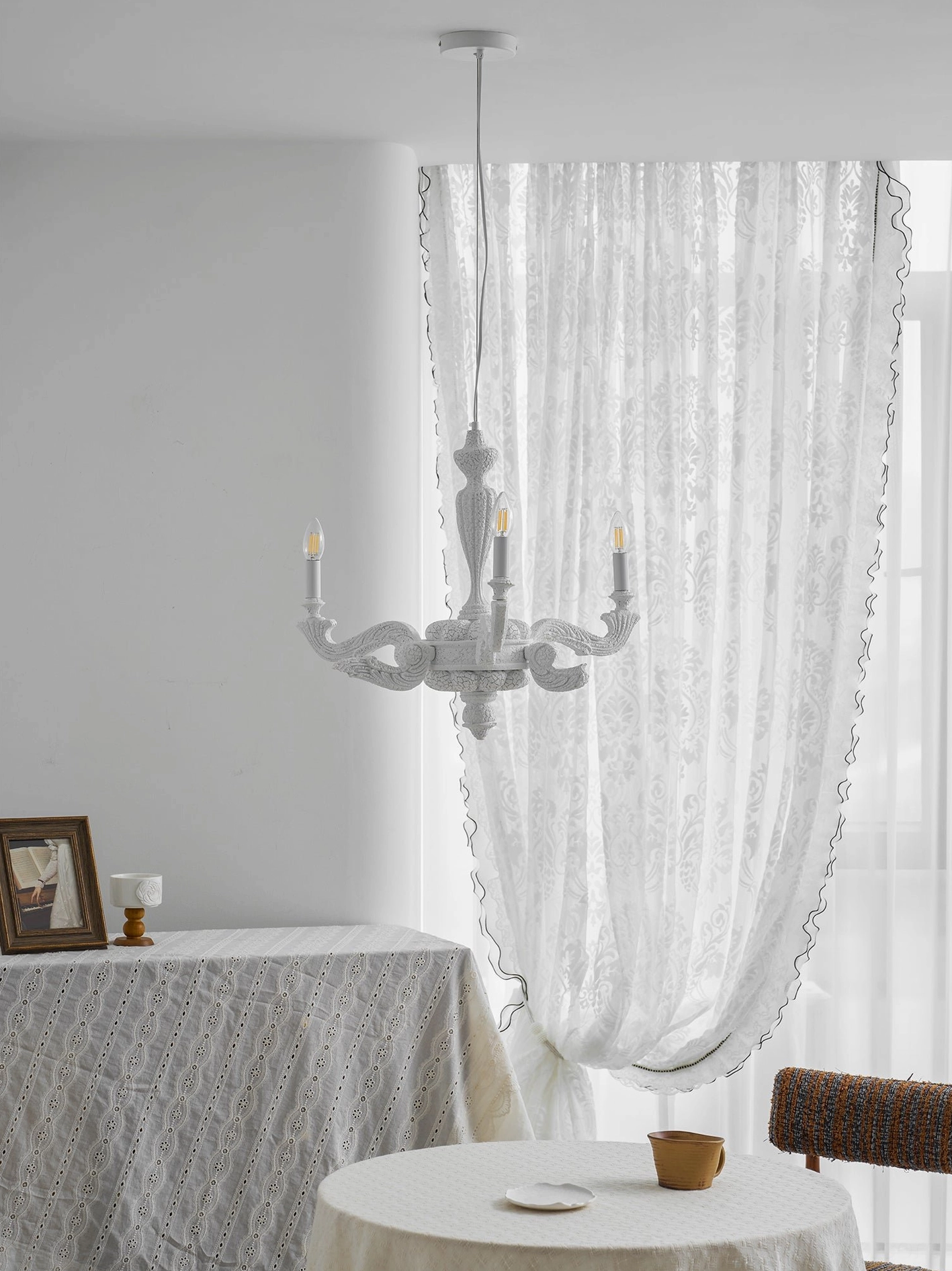 White Lvoria chandelier six-head configuration mounted in contemporary modern dining room