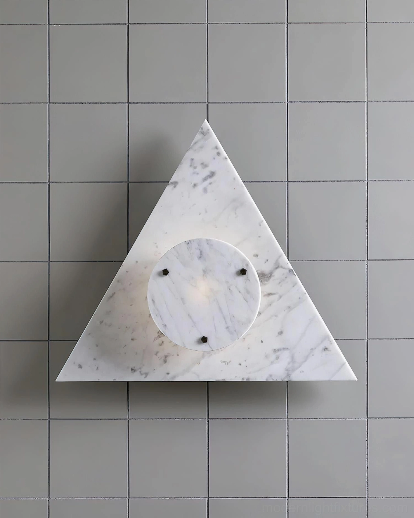 White natural marble geometric wall lamp on light gray tiled wall unlit