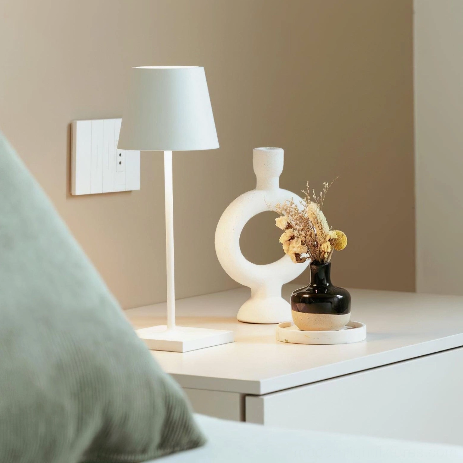 Modern white table lamp with tapered shade beside bedroom bedside neutral home decor