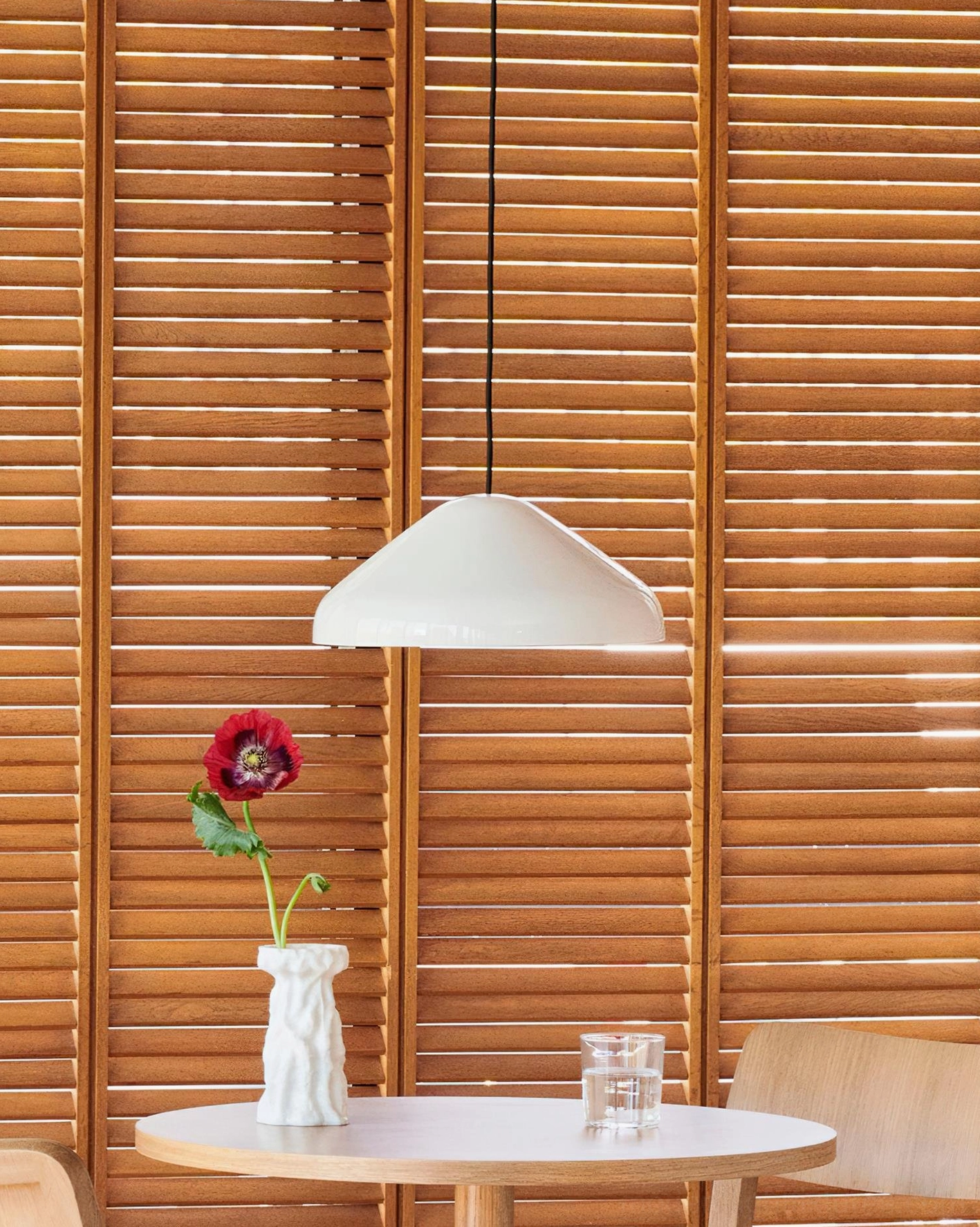White dome pendant light creating soft diffused illumination