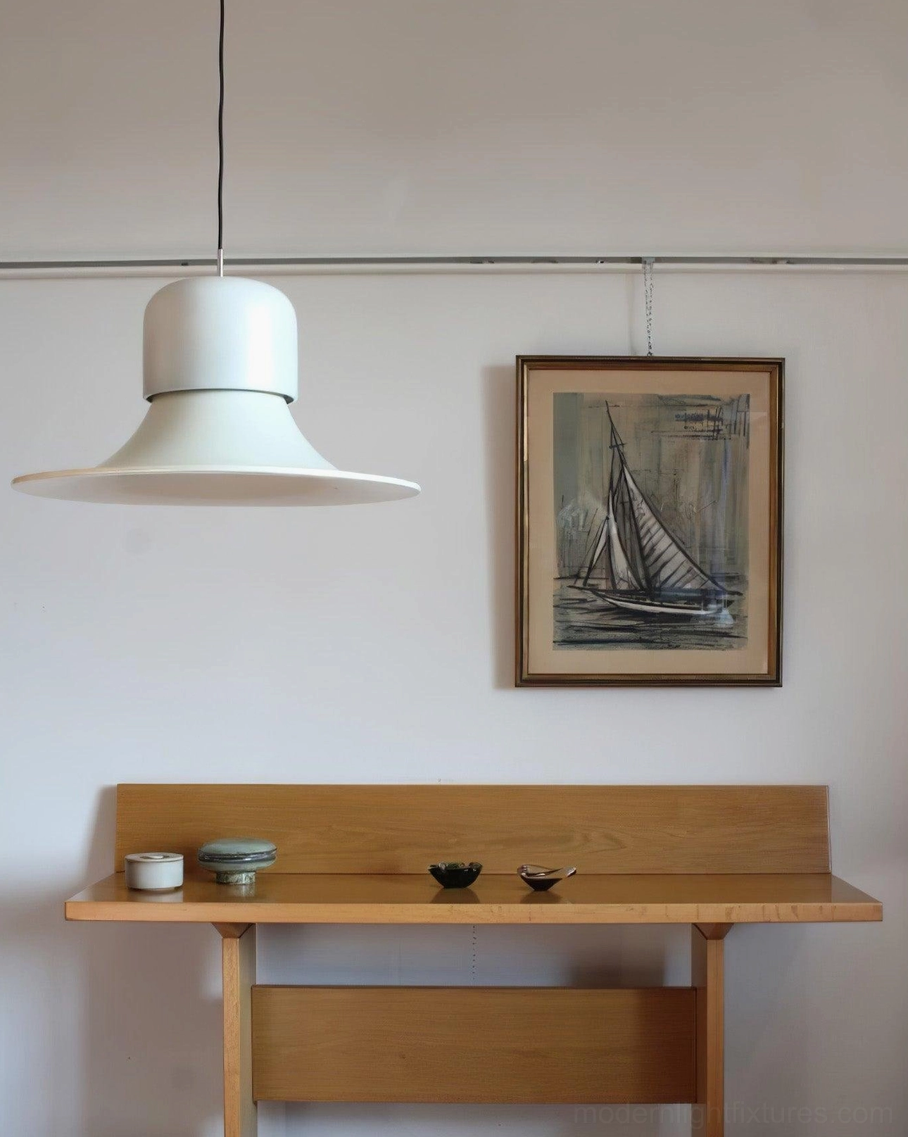 Off-white Nordisk pendant fixture installed in vintage entryway hallway with warm lighting