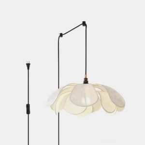 White fabric petal pendant light with etched floral patterns, front studio view showing overlapping petal shades and brass hardware
