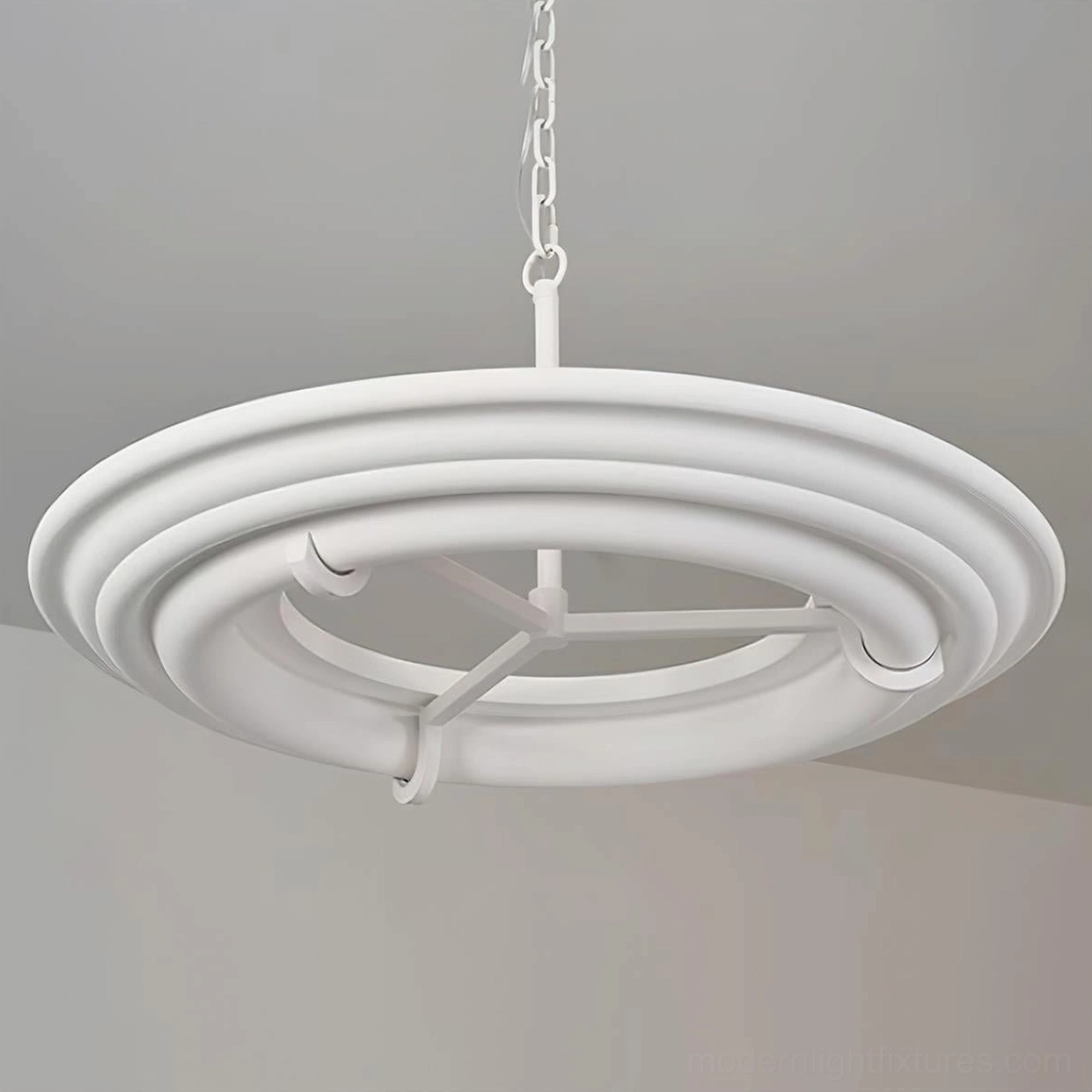 Close-up detail of layered white plaster rings showing matte finish and metal hardware