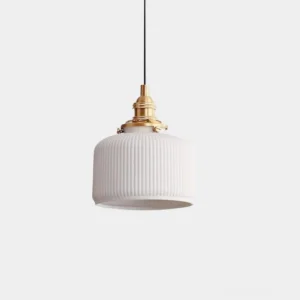 White ribbed ceramic pendant light with brass hardware, frontal studio view showing minimalist modern design