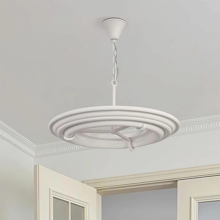 Minimalist white ring chandelier installed in residential entryway with crown molding details