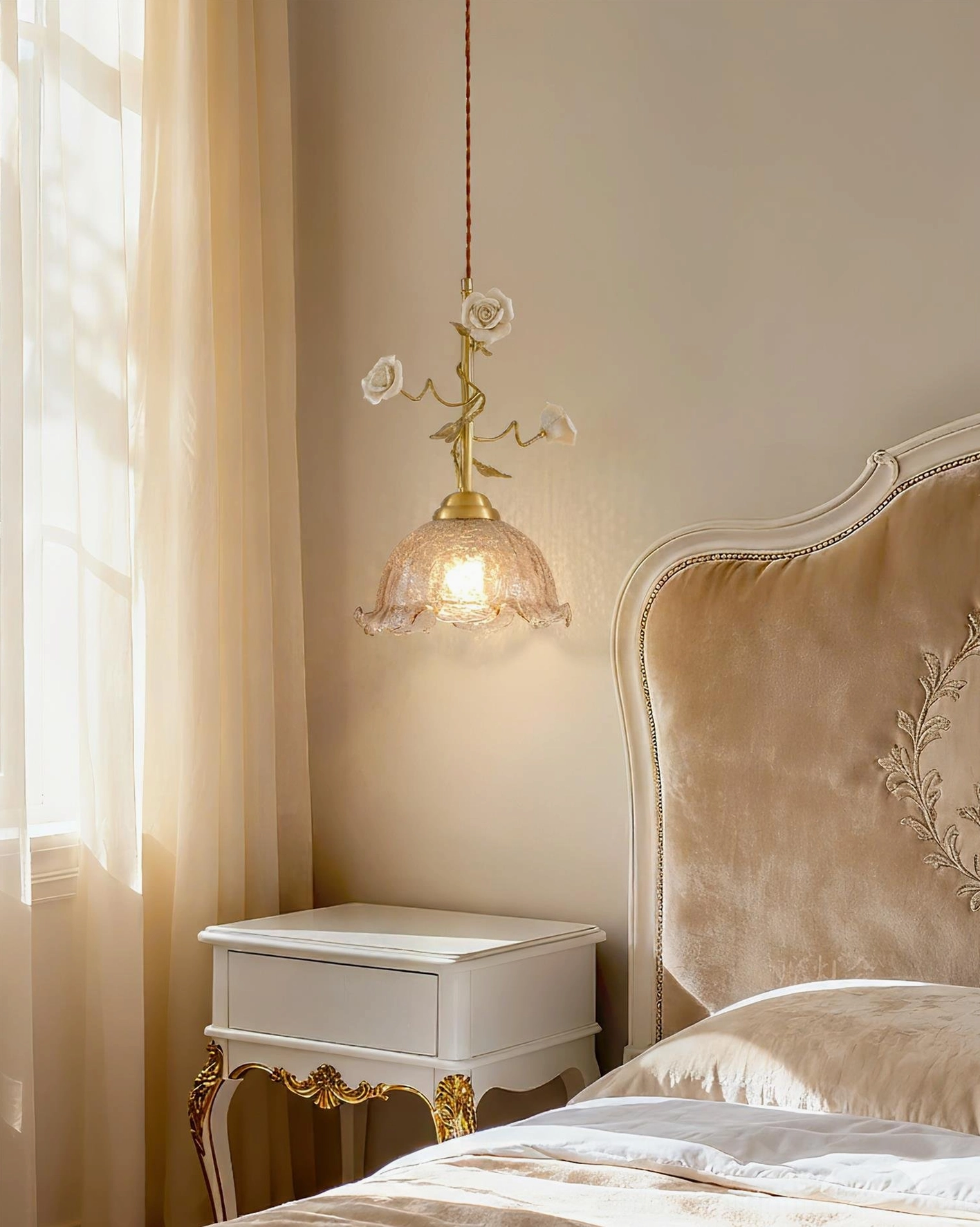 White ceramic rose pendant lamp with glowing rippled glass shade on luxury bedroom nightstand - romantic French pastoral lighting