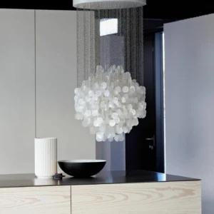 Modern white shell chandelier hanging in minimalist hallway with pure capiz shells and metal suspension chains