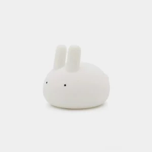 Matte white soft silicone bunny night light with rounded organic shape, front studio view