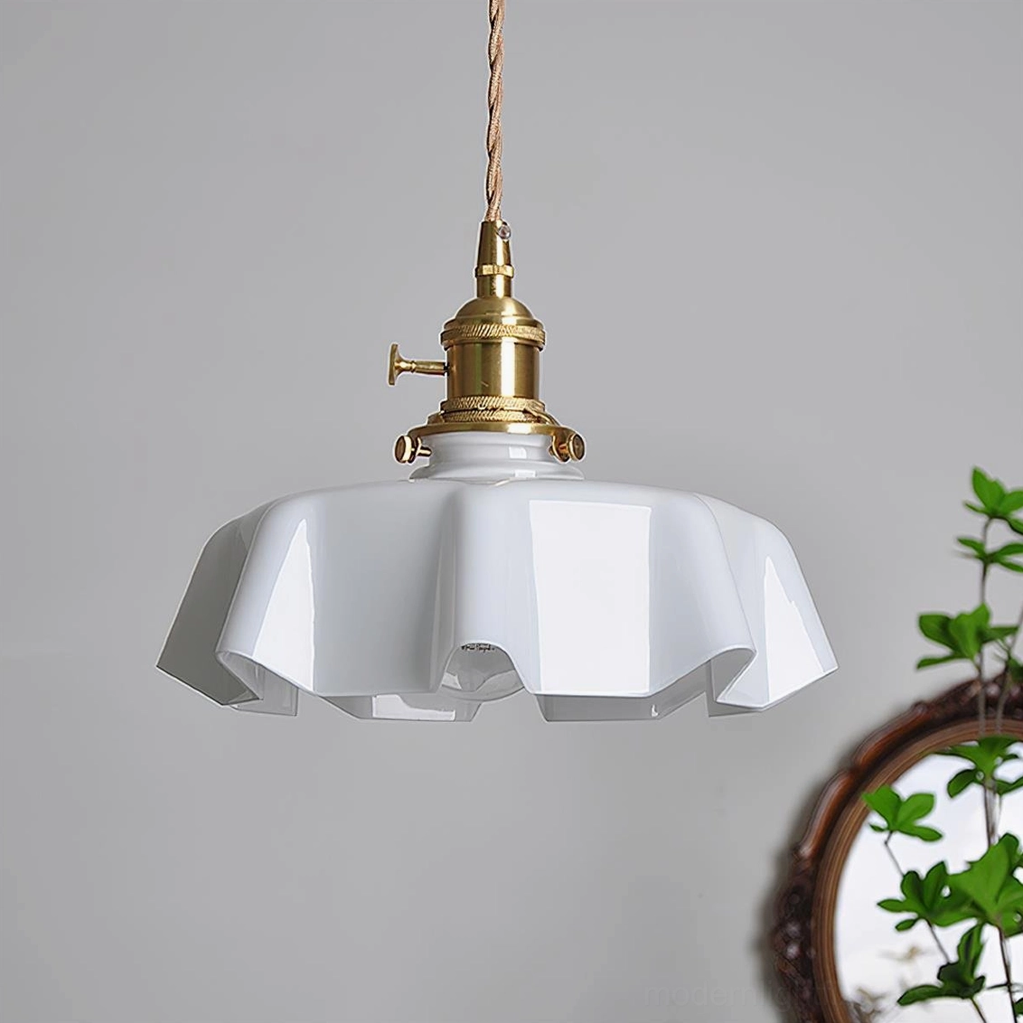White skirted ripple pendant lamp with glossy finish, brass fixture and switch, modern minimalist aesthetic