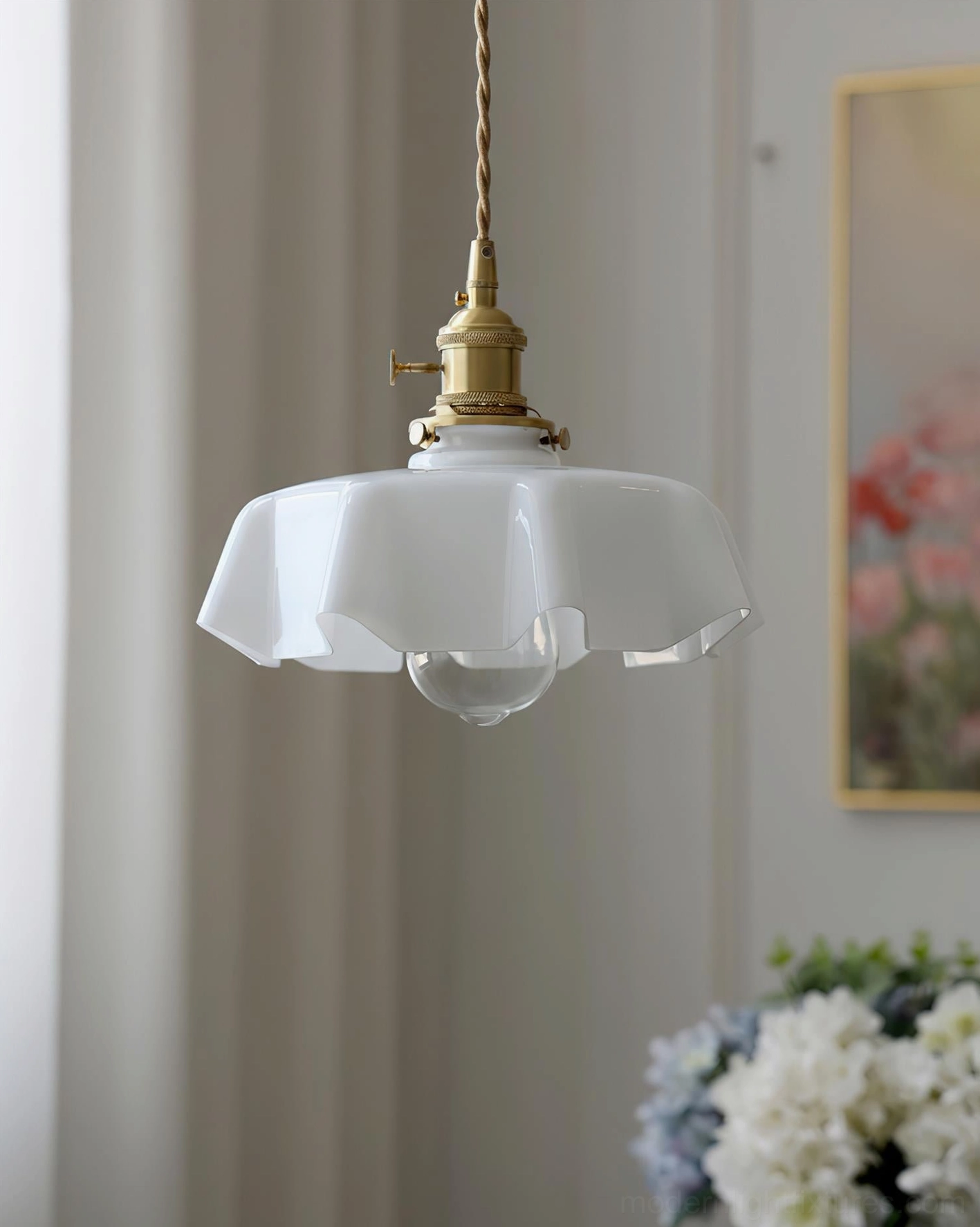 White pleated fabric-inspired glass pendant light with brass fixture, underside front view in decorated home setting