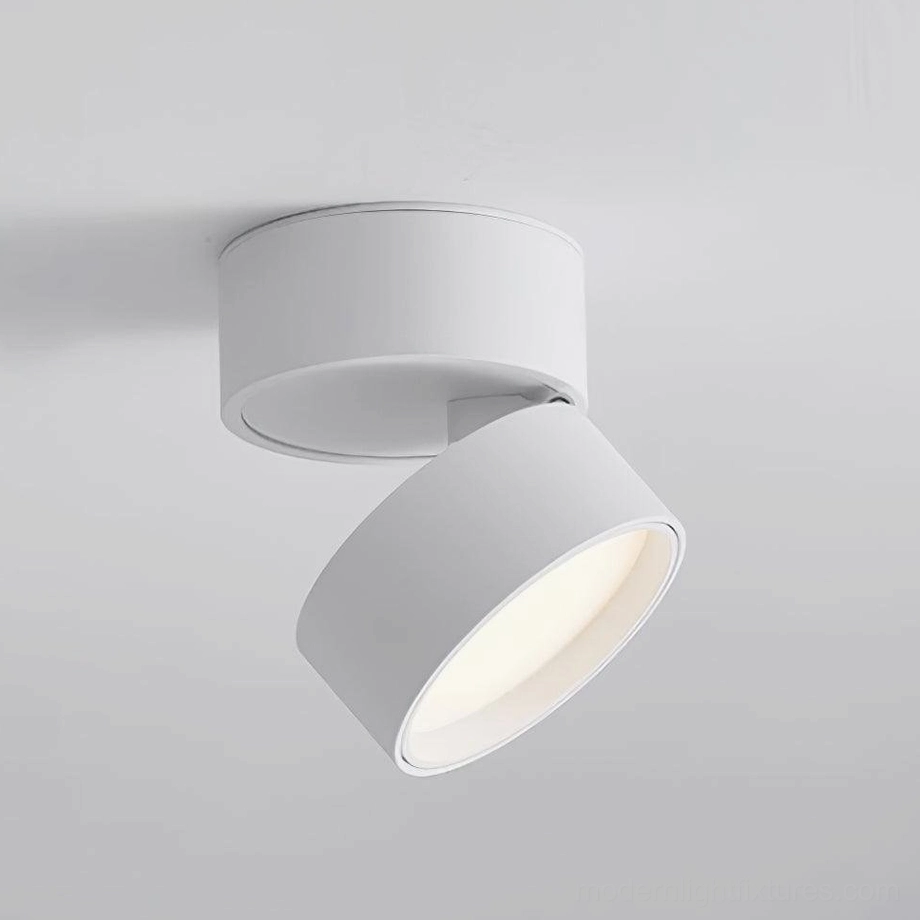 White compact surface mount ceiling spotlight in four-quarter close-up view - modern adjustable lighting fixture