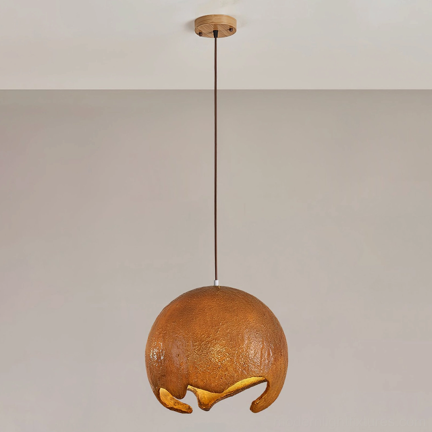 White textured moon crater pendant lamp with matte white spherical shade and white ceiling hardware, minimalist modern design