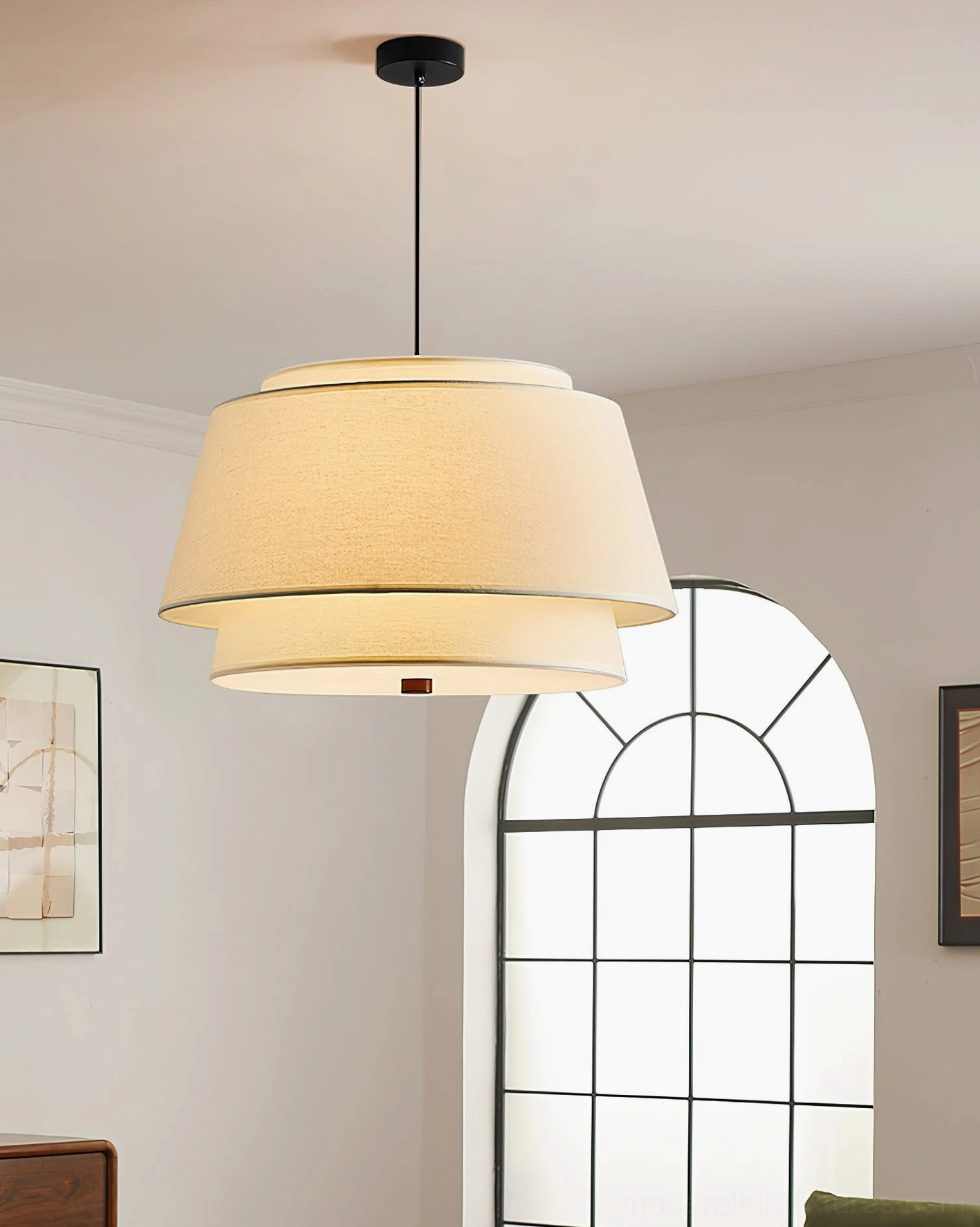 Clean off-white tiered pendant light with solid fabric shade in Scandinavian minimalist interior