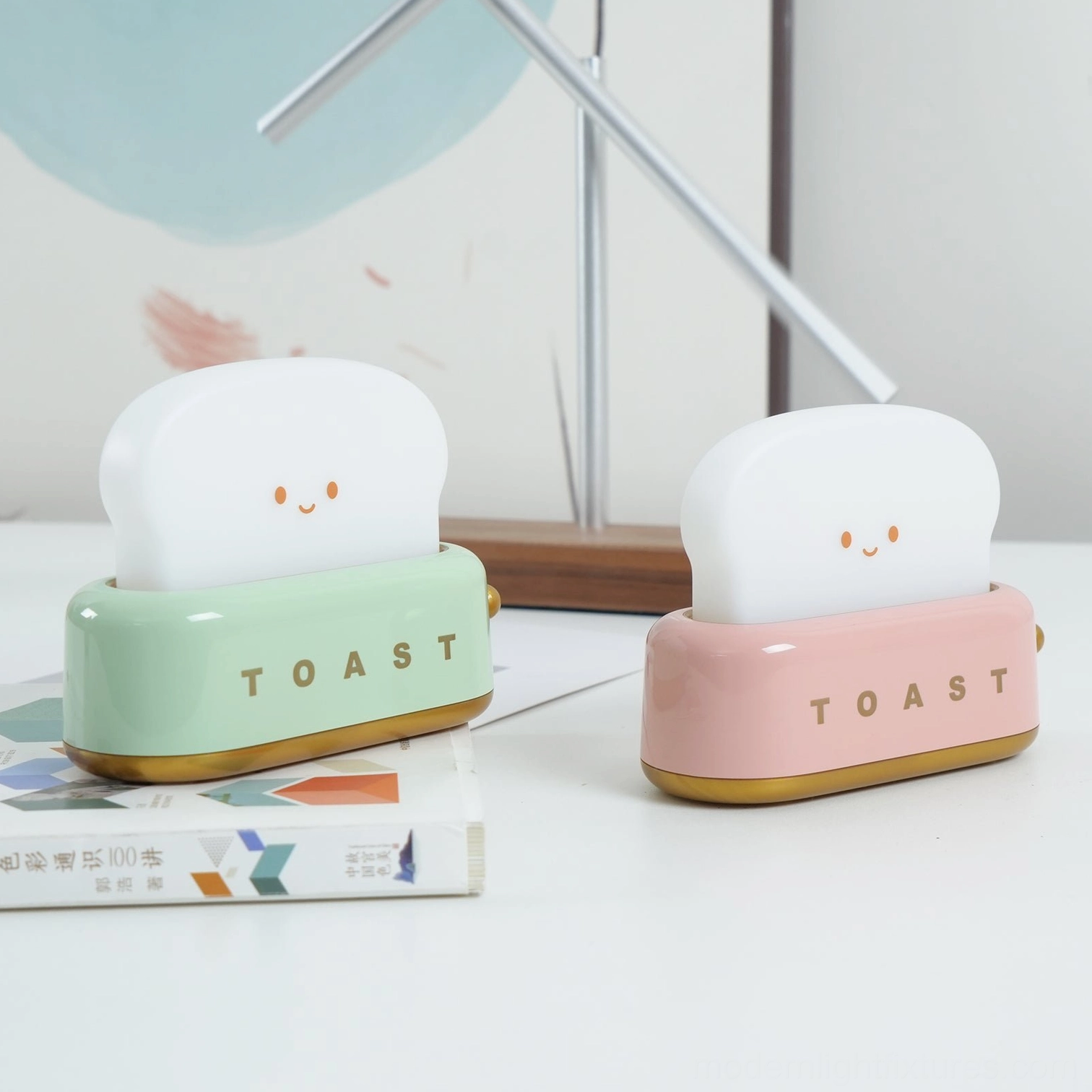 White toaster table lamp with minimalist aesthetic on contemporary home office desk