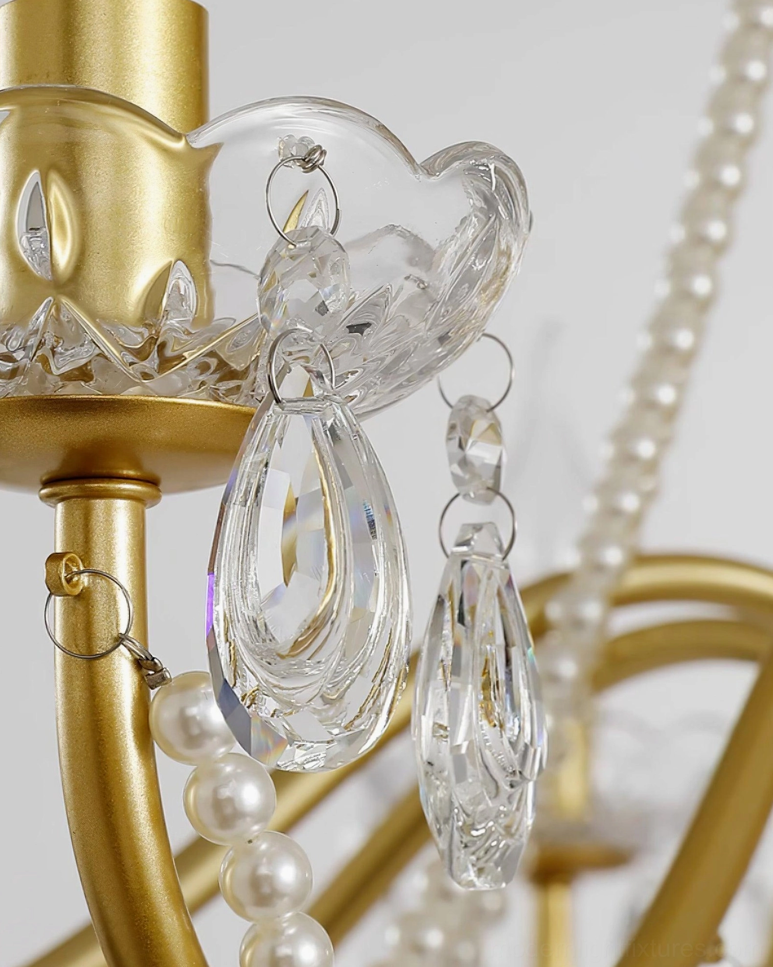 Crystal chandelier pendant lighting fixture with pristine clear crystals and warm gold brass components