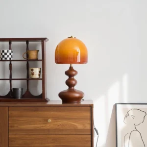 Willow mid-century modern table lamp on wooden dresser with home decor styling and ambient lighting