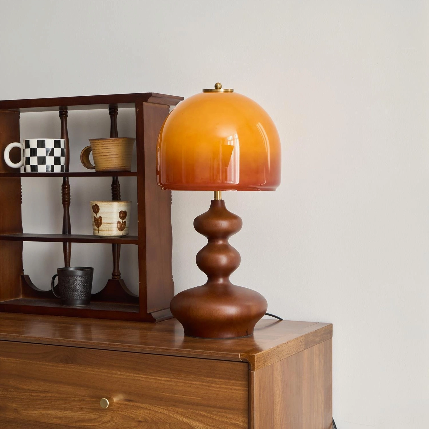 Willow caramel glass table lamp dome detail, amber light diffusion and glass texture closeup