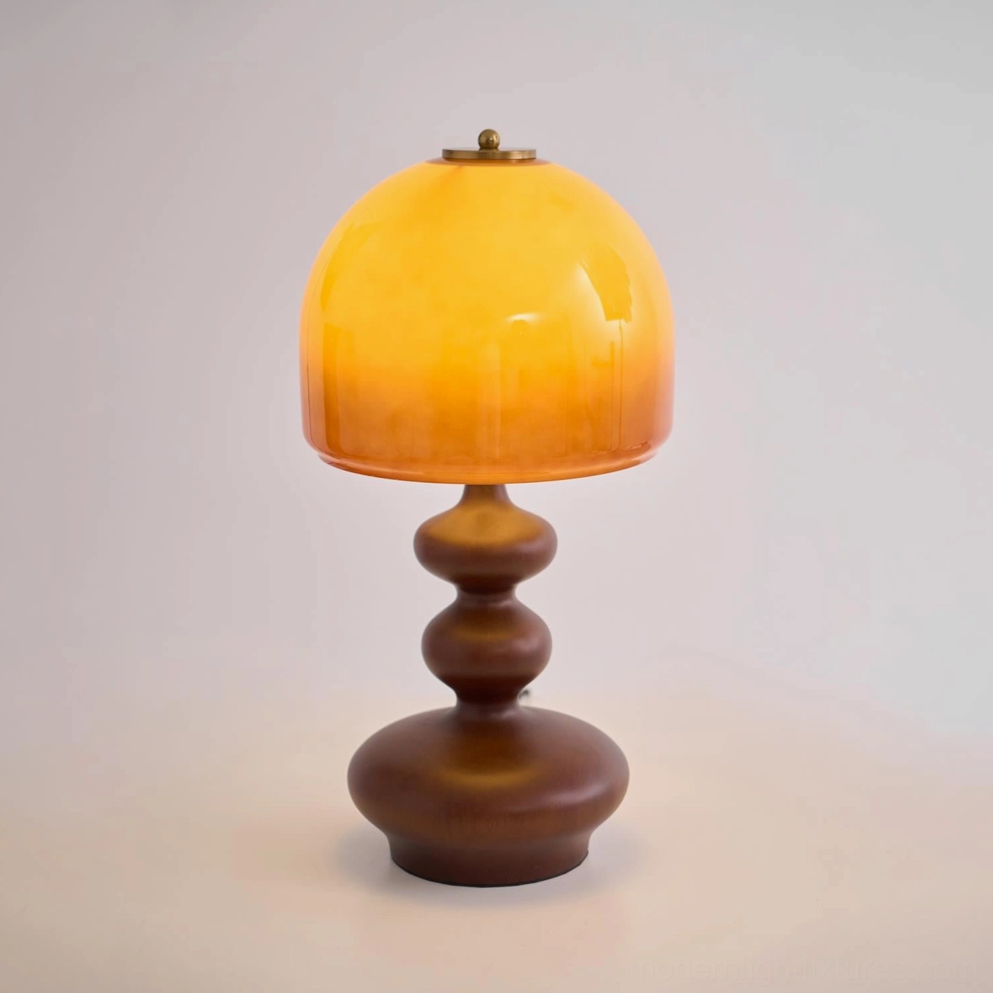Willow table lamp providing layered ambient light in living room design scheme