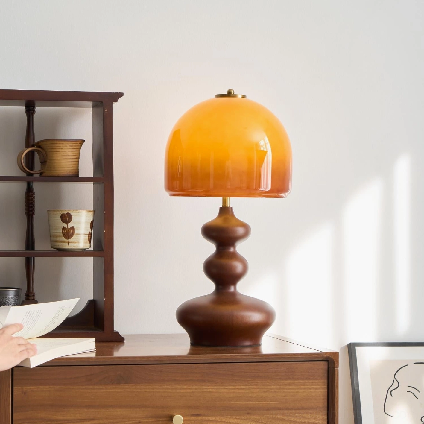 Willow table lamp mid-century modern aesthetic, warm wood base and caramel glass combination
