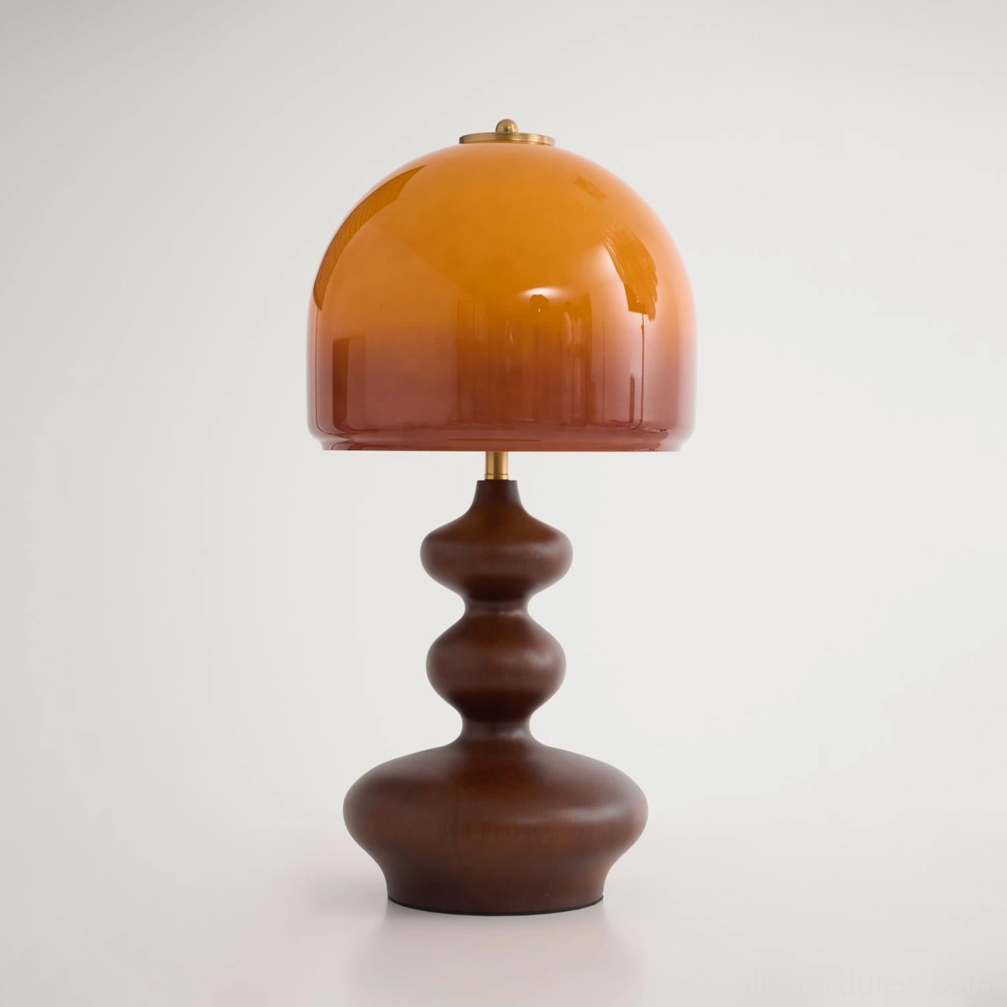 Willow table lamp side angle view, walnut wood base curves and caramel dome proportions