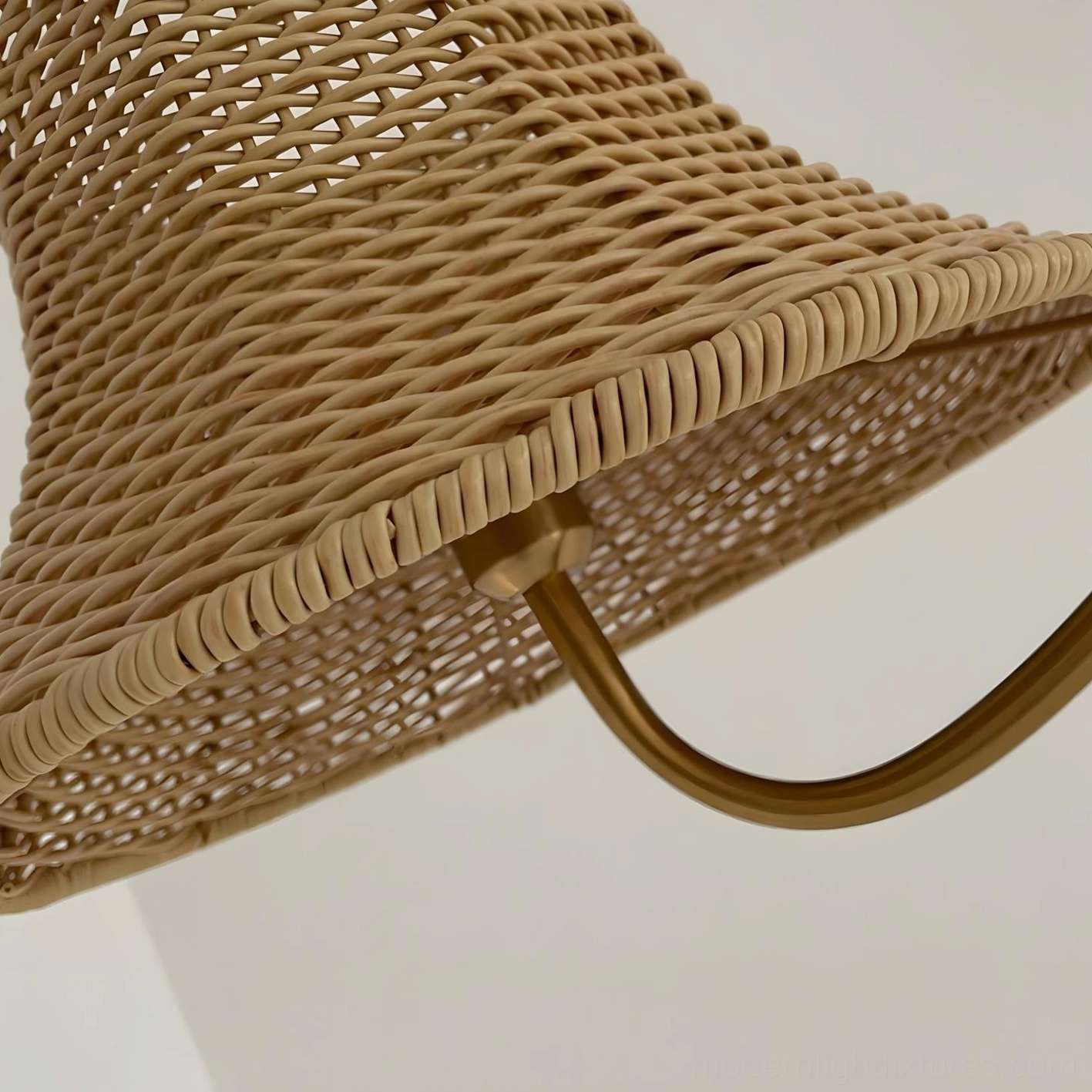 Willowen rattan arc floor lamp base and stem detail showing cane-wrapped construction and white round base