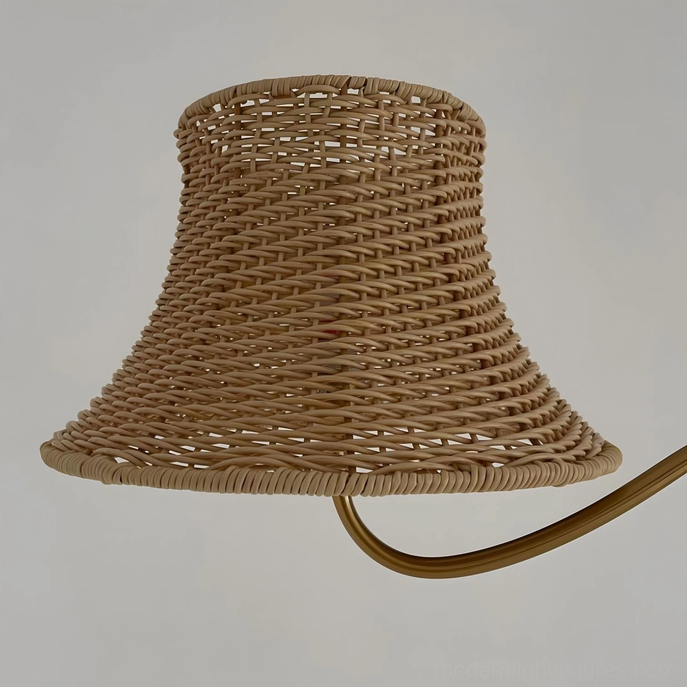 Willowen arc floor lamp with natural rattan shade showing warm diffused light distribution and bohemian design aesthetic
