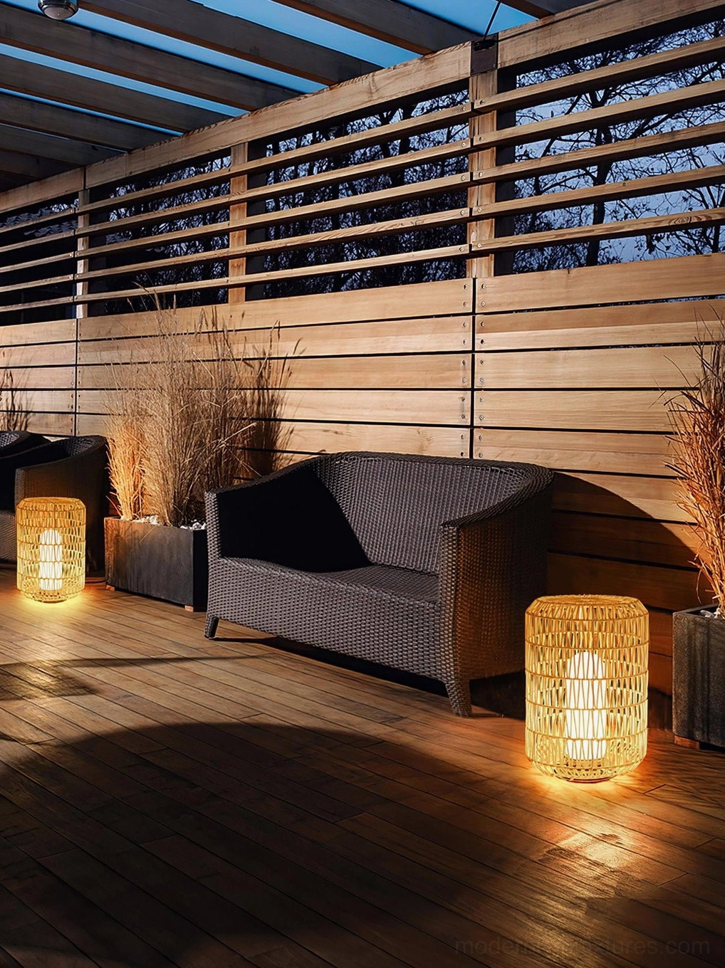 Wired rattan outdoor table lamp with integrated LED showing consistent warm illumination