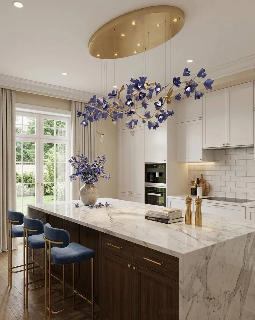 Large purple floral chandelier above kitchen island with marble countertop and dark cabinetry
